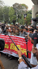 Large crowd protests in Dhaka streets beneath overpasses