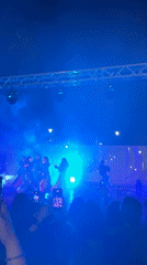 Coordinated dance troupe performs outdoor nighttime show in Málaga