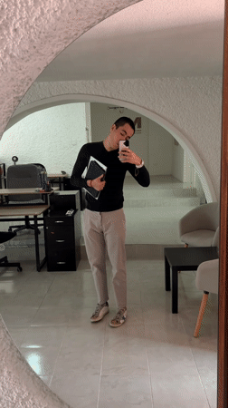 Man records selfie video with devices in Puebla mirror