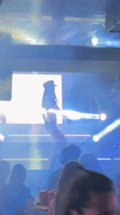 Red-clad performer entertains nightclub crowd in Panagyurishte, Bulgaria