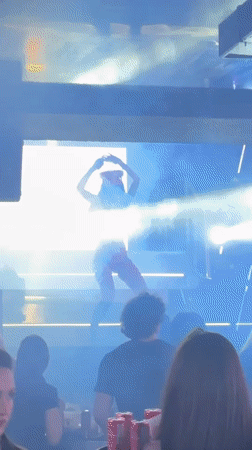 Red-clad performer entertains nightclub crowd in Panagyurishte, Bulgaria