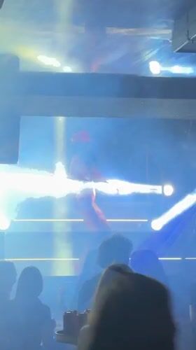 Red-clad performer entertains nightclub crowd in Panagyurishte, Bulgaria