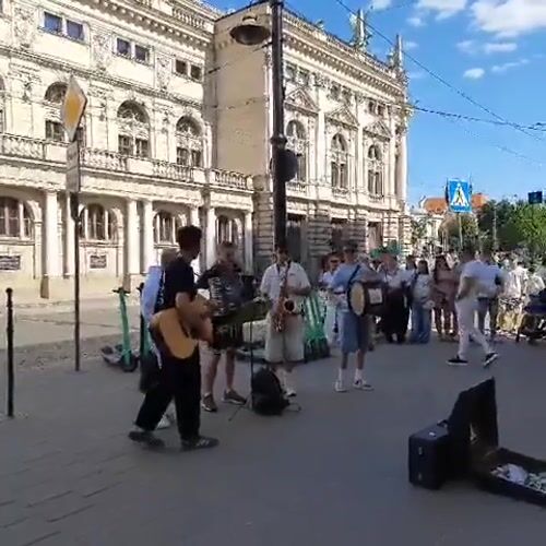 Live street music outside Lviv's Opera Theatre on Freedom Avenue