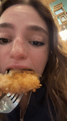 Woman enjoys late dinner at Puebla restaurant