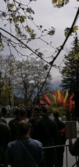 Military Victory Day ceremony features Soviet flags, vintage cars