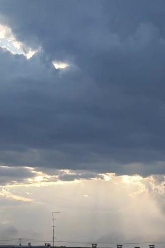 Shifting clouds and sunbeams over Rubtsovsk on a dramatic afternoon