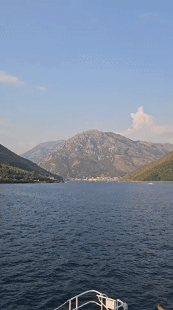 Ferry 'Grbalj Kotor' docked on Montenegro's Boka Bay shoreline