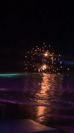 Fire show and fireworks light up a Ko Samui beach night