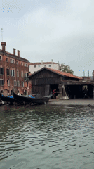 Inside a working gondola workshop on a Venice canal.