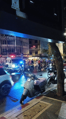 Emergency response at Bangkok intersection amid evening street activity