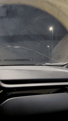 Night driving captured through cracked windshield in Montenegro