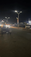 Evening street life captured around Jos roundabout monument