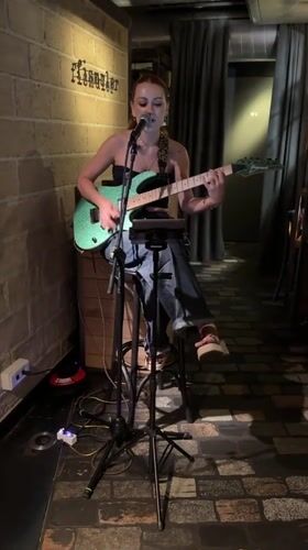 Solo electric guitar performance at a Barcelona venue