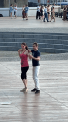 Informal dance gathering on waterside platform in Moscow