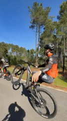Cyclists perform wheelie stunts on Vila Real road