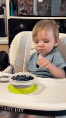 Toddler snack time and casual home moments in Noviy, Russia