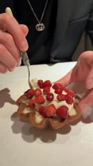 Man photographs, eats strawberry dessert at Moscow restaurant