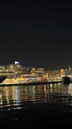 Winter Evening Activity Documented in Tromsø Harbor and Streets
