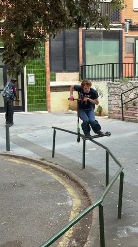 Young man performs scooter stunts on Badalona streets