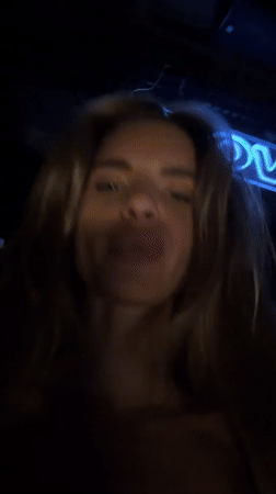Late night club scene in Berlin with dancing and neon
