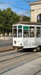 Everyday traffic and transit near Milan's Arco della Pace