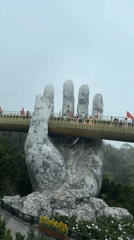 Tourists visit Vietnam's Golden Bridge amid misty morning weather