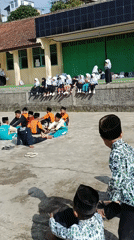 School children gather in groups during day at Indonesian school