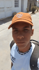 Young man walks street in El Espinal, Venezuela
