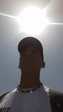 Young man walks street in El Espinal, Venezuela