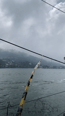 Cloudy day lakeside activity captured in Sarangan, Indonesia