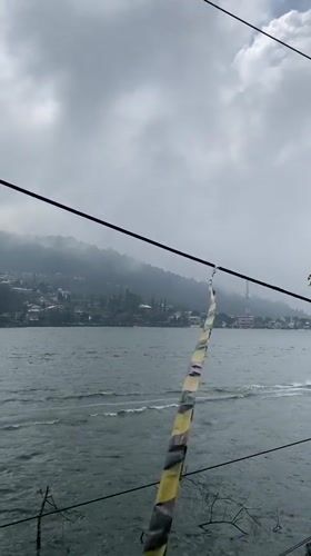 Cloudy day lakeside activity captured in Sarangan, Indonesia