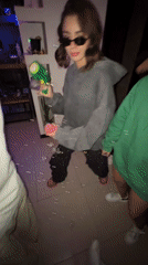 Child plays with bubble gun in Mexico City room
