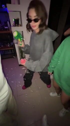 Child plays with bubble gun in Mexico City room
