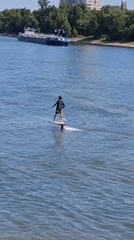 Foilboards, boats, and helicopters on the Rhine in Cologne