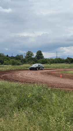 BMW drivers practice maneuvers on dirt track in Bulgaria