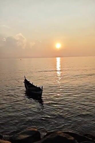 Clouded sunset captured over Indonesian waters near Lhokseumawe