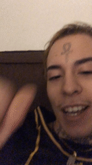 Tattooed person singing, smiling in Buenos Aires early morning