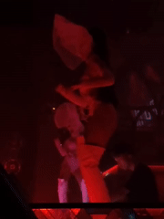 MU:IN Bali live show: dancers and DJ under red lights
