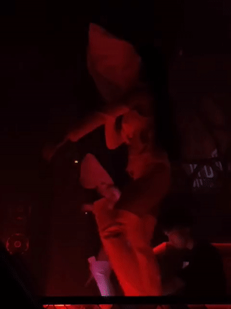 MU:IN Bali live show: dancers and DJ under red lights