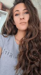 Woman takes selfies in Chepintsi, Bulgaria bedroom setting