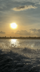 Sunset captured over water in Denpasar, Indonesia