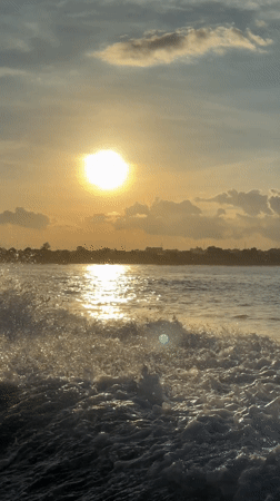 Sunset captured over water in Denpasar, Indonesia