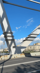 Sunny afternoon bridge crossing documented in Saint Petersburg