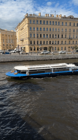 Passenger boat cruising a busy Saint Petersburg river