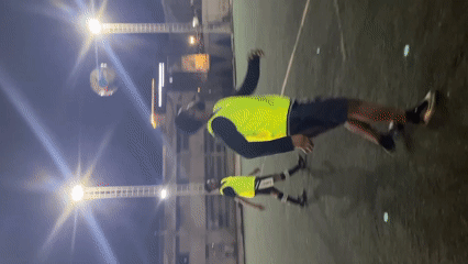 Soccer practice session on illuminated Accra field