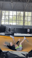 Man performs trampoline stunts at Krasnoyarsk indoor park