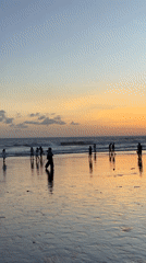 Sunset beach activities captured at North Kuta, Indonesia