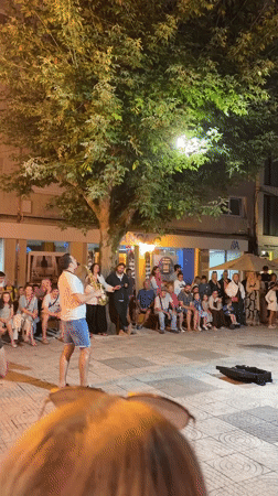 Live saxophone performance draws a crowd in Sanxenxo plaza