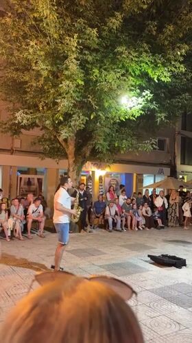 Live saxophone performance draws a crowd in Sanxenxo plaza