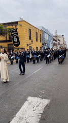 Flower floats and marching band fill Trujillo streets in evening parade